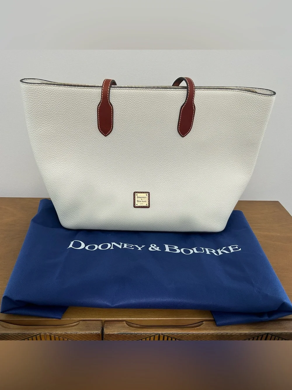 Dooney & Bourke White Pebbled Leather Tote with Brown Trim and Handles